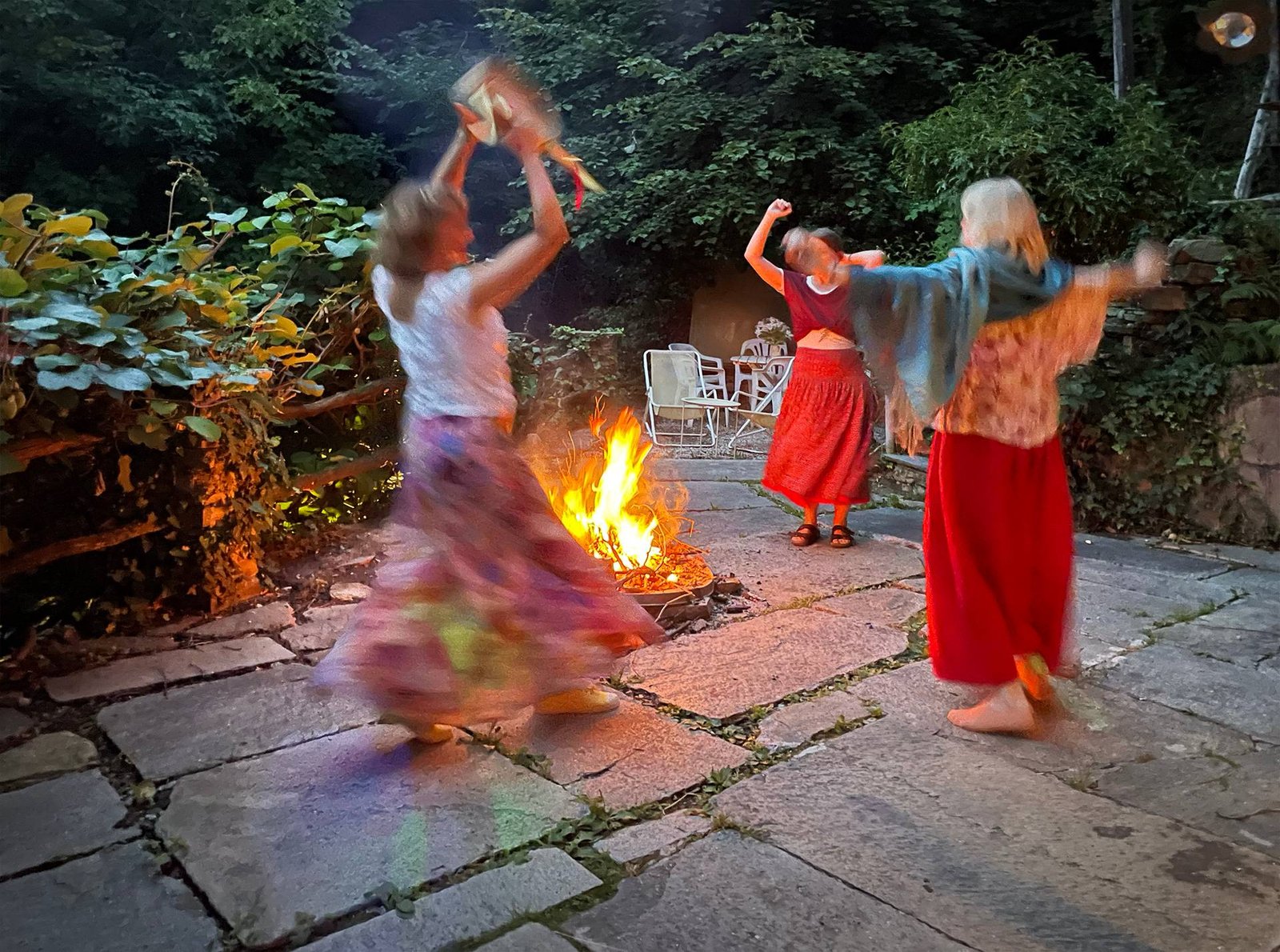 Dancing by the fire in the courtyard